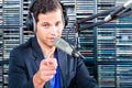 Male radio presenter in radio station on air Royalty Free Stock Photo