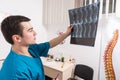 Doctor analysing X-ray image of human spine Royalty Free Stock Photo