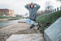 Male rapper posing on the street, urban dancing