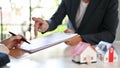 Male real estate agent or realtor and a female client having a meeting to sign the rent contract Royalty Free Stock Photo