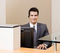 Male receptionist with telephone earpiece