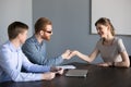 Male recruiter handshaking female employee at job interview Royalty Free Stock Photo