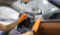 Male repairman cleaning air duct of car with brush closeup Royalty Free Stock Photo