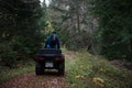 Rescuer Inspecting Woods Area by Atv Quad Bike