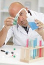 Male researcher holding flask with blue liquid in lab Royalty Free Stock Photo
