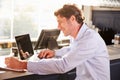 Male restaurant manager working on laptop Royalty Free Stock Photo