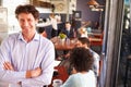 Male restaurant owner, portrait with arms crossed