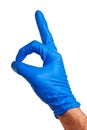 Male right hand in blue latex glove.