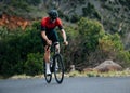 Male road bike rider doing intense and tough training