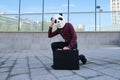 Male robber wearing a panda head mask stealing a briefcase tired of running
