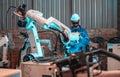 An male robotic welding operator is responsible for A Royalty Free Stock Photo