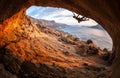 Male rock climber climbing along a roof in a cave Royalty Free Stock Photo