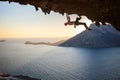 Male rock climber climbing along a roof in a cave Royalty Free Stock Photo