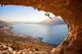 Male rock climber climbing along a roof in a cave Royalty Free Stock Photo