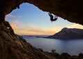 Male rock climber climbing along a roof in a cave Royalty Free Stock Photo