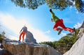 Male rock climber the man jumps over the rift in the stones Royalty Free Stock Photo