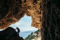 Male rock climber silhouette on a cliff in a cave Royalty Free Stock Photo