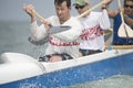 Male Rower With Team Paddling Outrigger Canoe