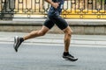 male runner in black tights running city marathon Royalty Free Stock Photo