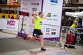 Male runner celebrates finish of marathon