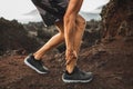 Male runner holding injured calf muscle with pain Royalty Free Stock Photo