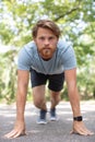 male runner poised to start