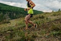 male runner running down mountain