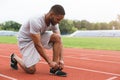 Runner tying running shoes laces. Royalty Free Stock Photo