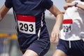 Male runners finalizing a race in a running track Royalty Free Stock Photo