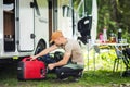 Male RV Traveler Setting Up a Camping Spot Royalty Free Stock Photo