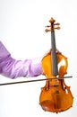 Male's hand holding violin