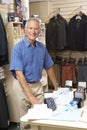 Male sales assistant in clothing store Royalty Free Stock Photo