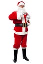 Male santa with alarm clock, studio shot. Royalty Free Stock Photo