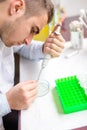 Male scientist and chemist examining samples and chemical elements