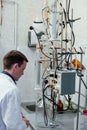 Male scientist conducts chemical experiments with fluids in medical laboratory Royalty Free Stock Photo