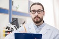 Male scientist in eyeglasses