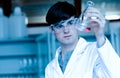 Male Scientist Looking At An Erlenmeyer Flask