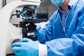 Male scientist looking at slides under the microscope Royalty Free Stock Photo