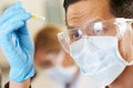 Male Scientist Studying Test Tube In Laboratory