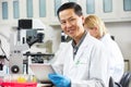 Male Scientist Using Tablet Computer In Laboratory Royalty Free Stock Photo