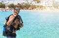 Male scuba diver showing the OK sign