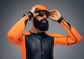 Male in scuba diving mask and orange neopren diving suit. Royalty Free Stock Photo