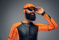 Male in scuba diving mask and orange neopren diving suit. Royalty Free Stock Photo