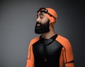 Male in scuba diving mask and orange neopren diving suit. Royalty Free Stock Photo