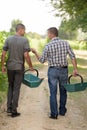 male seasonal workers going to harvest grapes