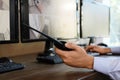 Male security guard with portable transmitter at workplace. CCTV surveillance Royalty Free Stock Photo
