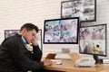 Male security guard sleeping near monitors Royalty Free Stock Photo