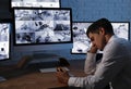 Male security guard sleeping near monitors Royalty Free Stock Photo