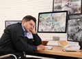 Male security guard sleeping near monitors Royalty Free Stock Photo