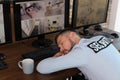 Male security guard sleeping at workplace. Royalty Free Stock Photo